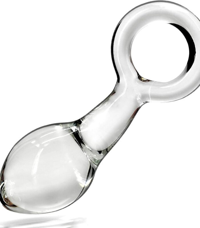 The Glass Butt Plug with Pull Loop Anal Plug features a smooth glass construction paired with a convenient pull loop for easy handling and removal. Its polished surface gives it a sleek, premium appearance while the compact design makes it simple to clean and store. Key Features Smooth Glass Construction: Polished glass provides a sleek, firm surface. Pull Loop Design: Integrated loop offers convenient handling and controlled removal. Secure Base: Helps keep the product stable during use. Easy to Clean: Non-porous glass can be thoroughly cleaned after each use. Reusable Design: Suitable for repeated adult use with proper care. Compact & Discreet: Easy to store when not in use. Stylish Appearance: Clear glass design gives the product a modern look. Practical Design The smooth glass body is designed for easy maintenance, while the pull loop provides a convenient grip. The secure base and streamlined shape make the product straightforward to handle. Care Instructions Clean thoroughly before and after each use. Use a compatible personal lubricant to reduce friction and improve comfort. Inspect the glass carefully before use and discontinue use if any chips, cracks, or damage are visible. Store in a clean, dry location away from direct sunlight and excessive heat. Product Highlights Product Type: Glass Butt Plug Material: Glass Design: Pull Loop Surface: Smooth & Polished Base: Secure Base Use: Adult Use Only Maintenance: Easy to Clean & Reusable